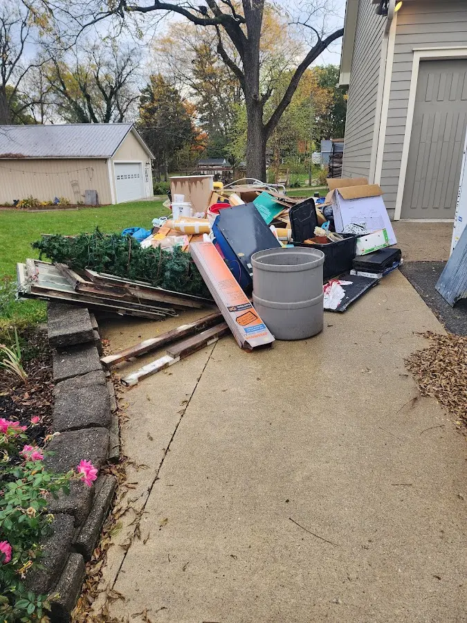 Dumpster being loaded with debris for 3 Yard Dumpster Rental in Puyallup